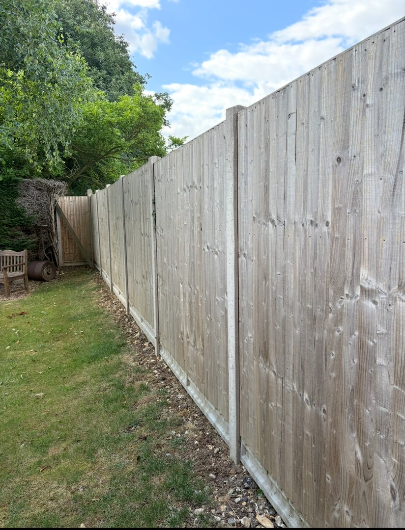 Fence before professional weatherproofing and painting treatment