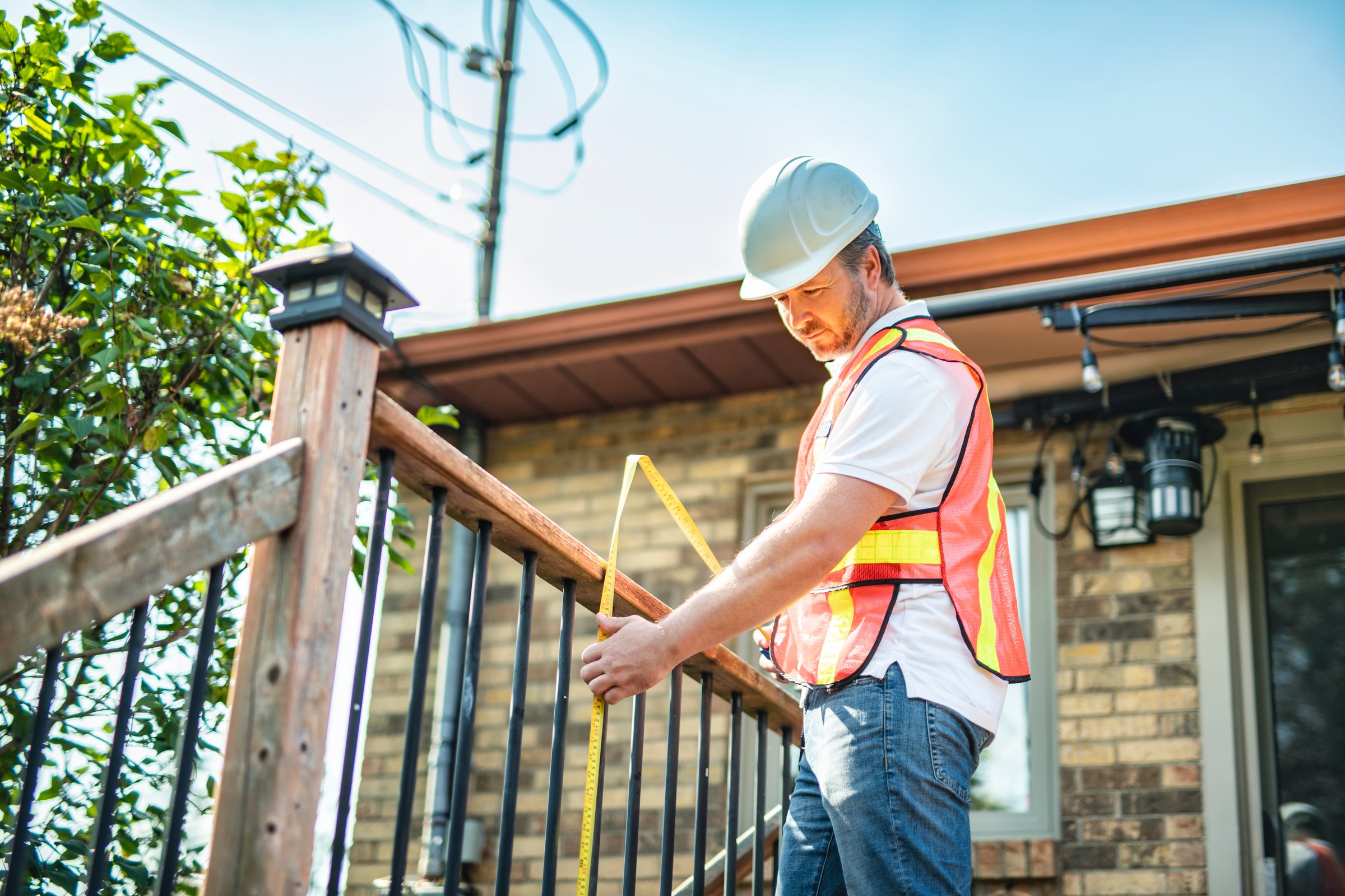A Safety fence at swimmimg pool with worker inspection men