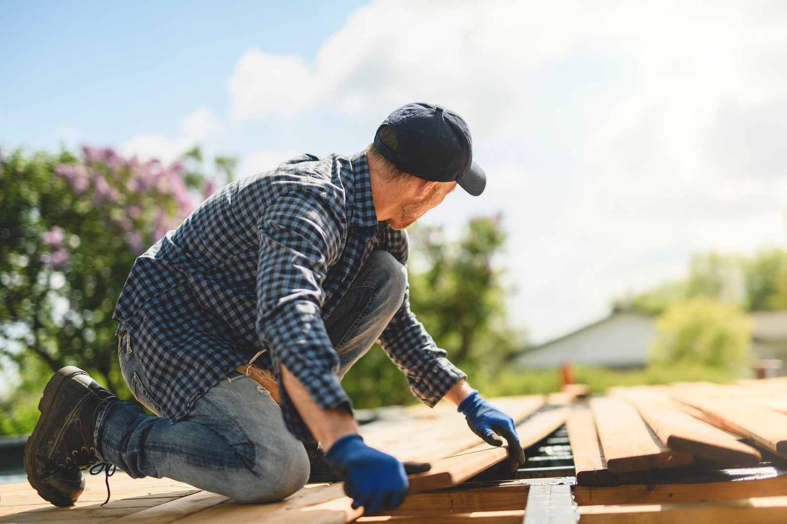 A Handyman worker making patio outside close to a pool