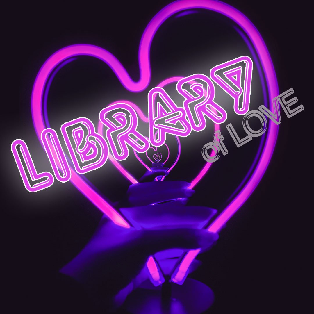 Purple neon heart with Library of Love text, held by a hand, glowing in the dark.