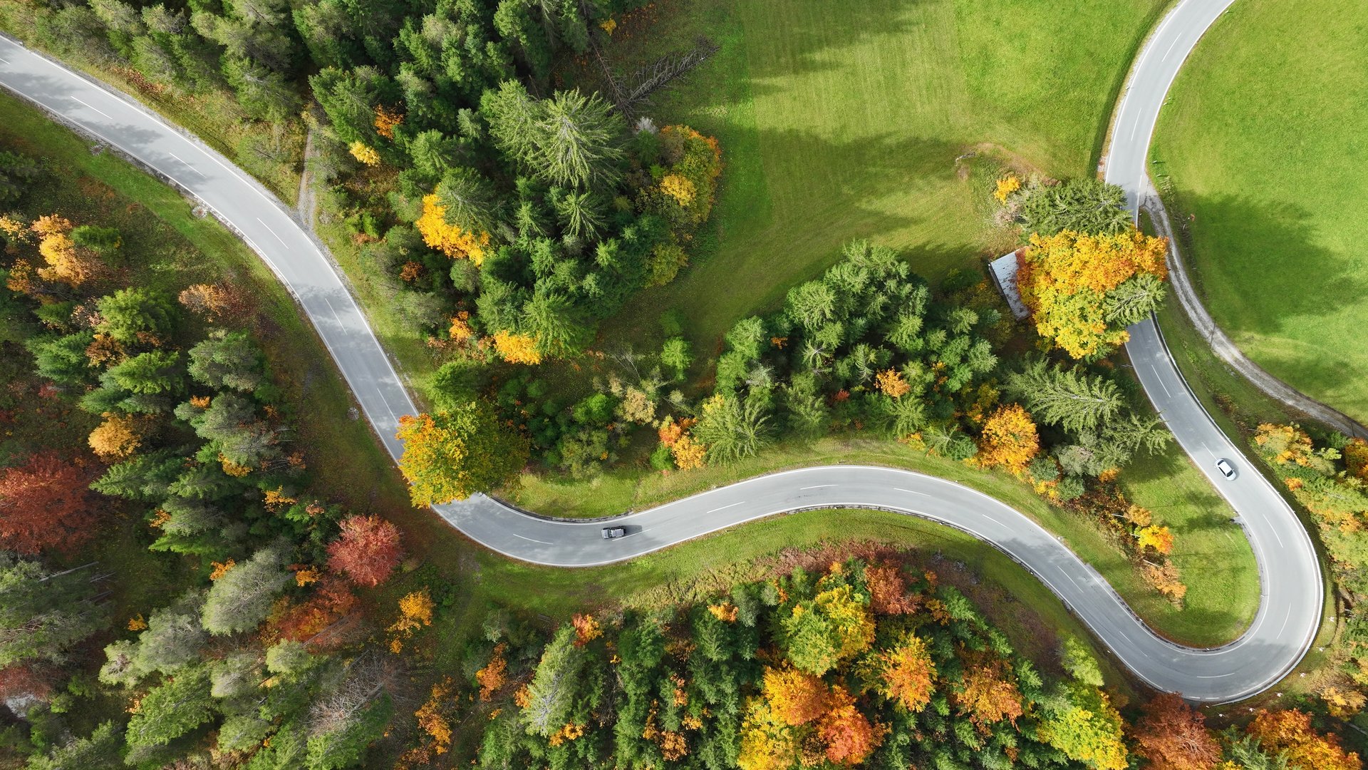 Drone shot of a winding road in the fall in Austria
