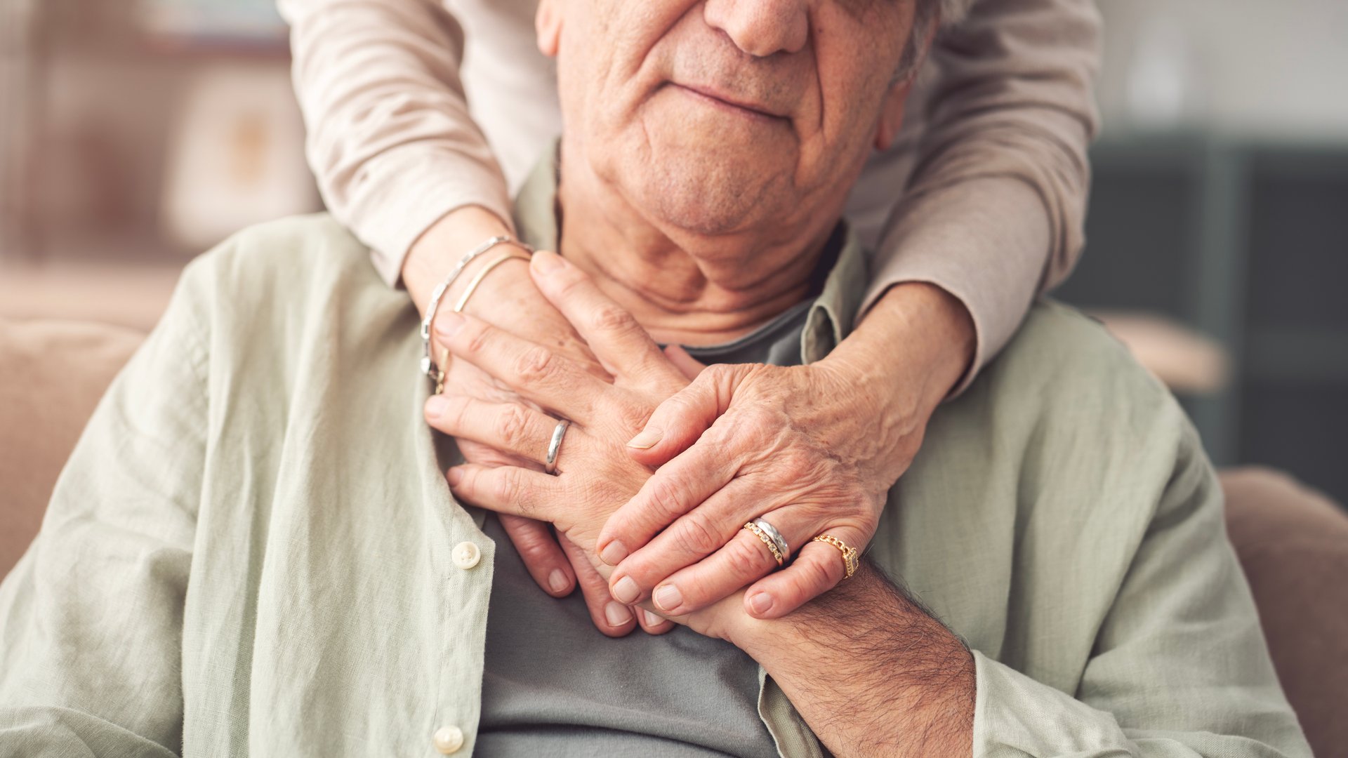 A wife embracing his husband with affection