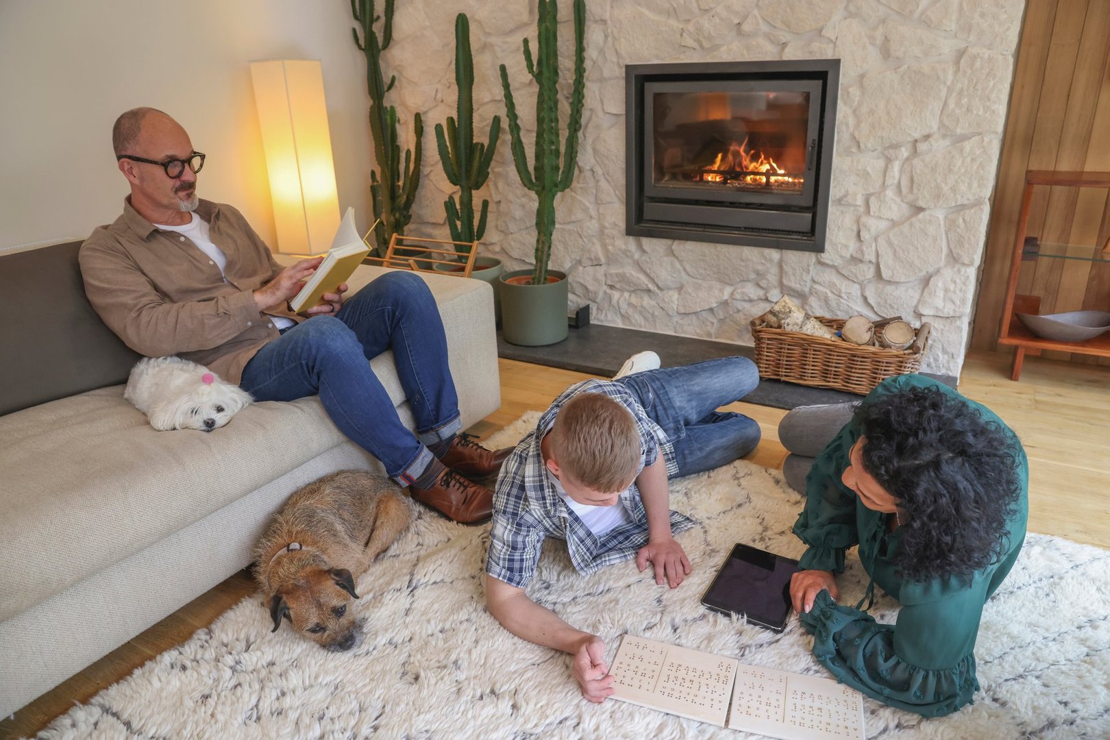 Family relaxing together in Roswell living room on area rug - professional rug cleaning services for homes in Atlanta GA