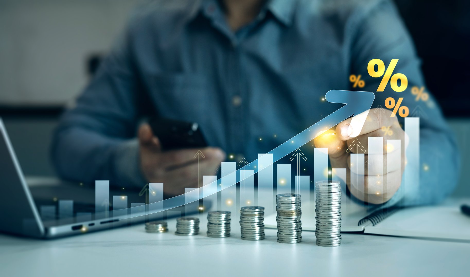 Man calculating income and return in percent.Percentage interest rates continue to increase, stocks and mutual funds, compensation fund, investment,retirement and dividend tax graph