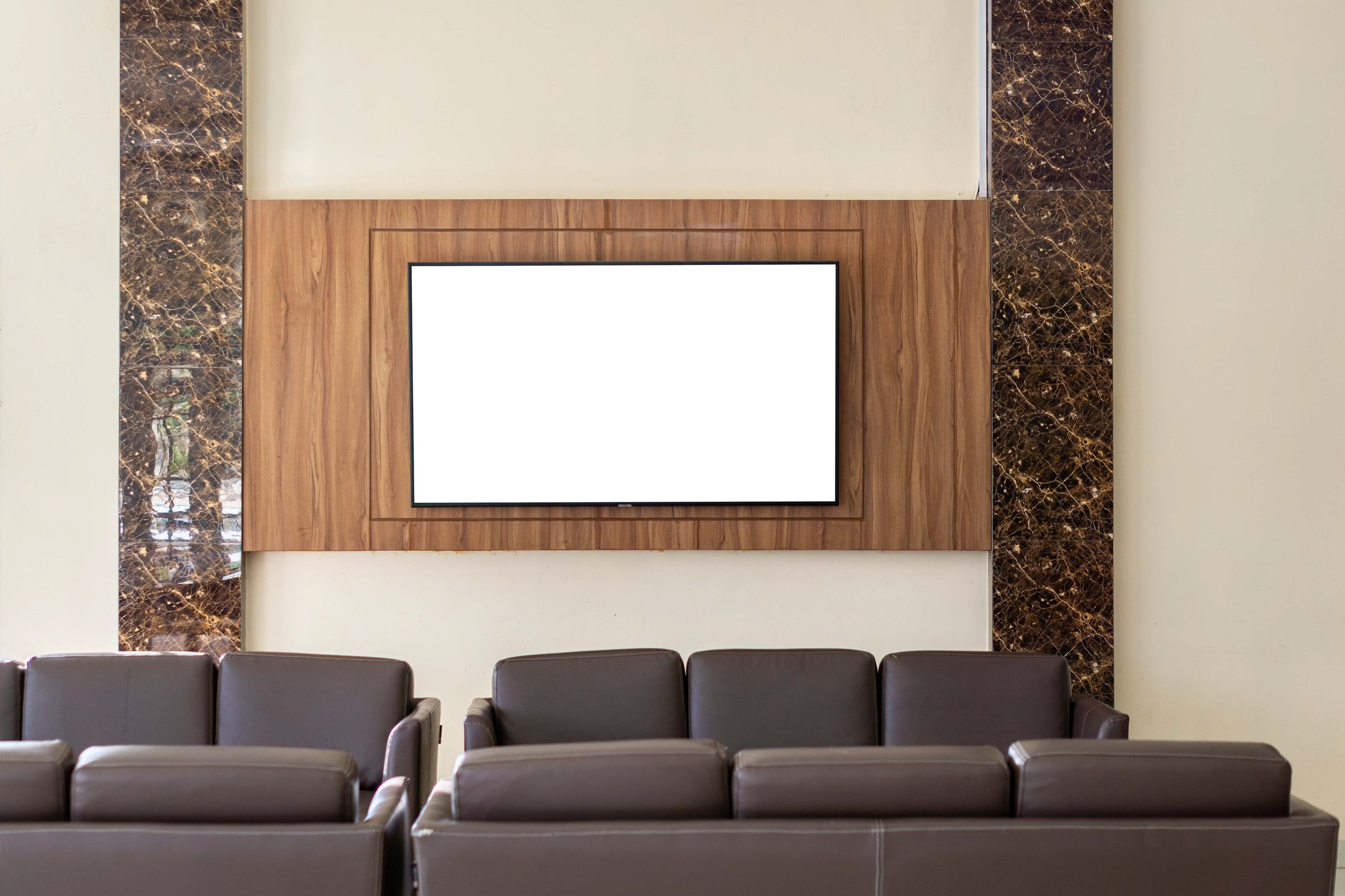 Blank TV screen for advertisement at the hotel welcoming lobby. White blank television mockup at the hotel offices reception