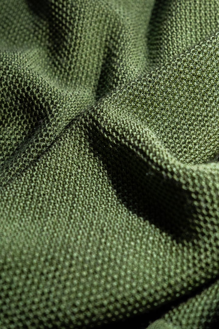 Green mesh textured fabric under the light
