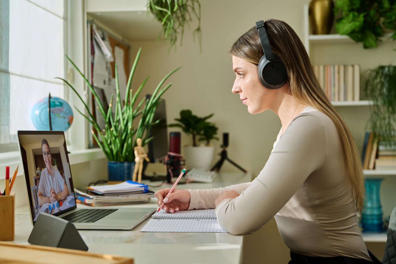 Young female on online therapy with psychologist psychotherapist, using video conference call on laptop. Technology, health care, mental support social services, psychology psychotherapy youth concept
