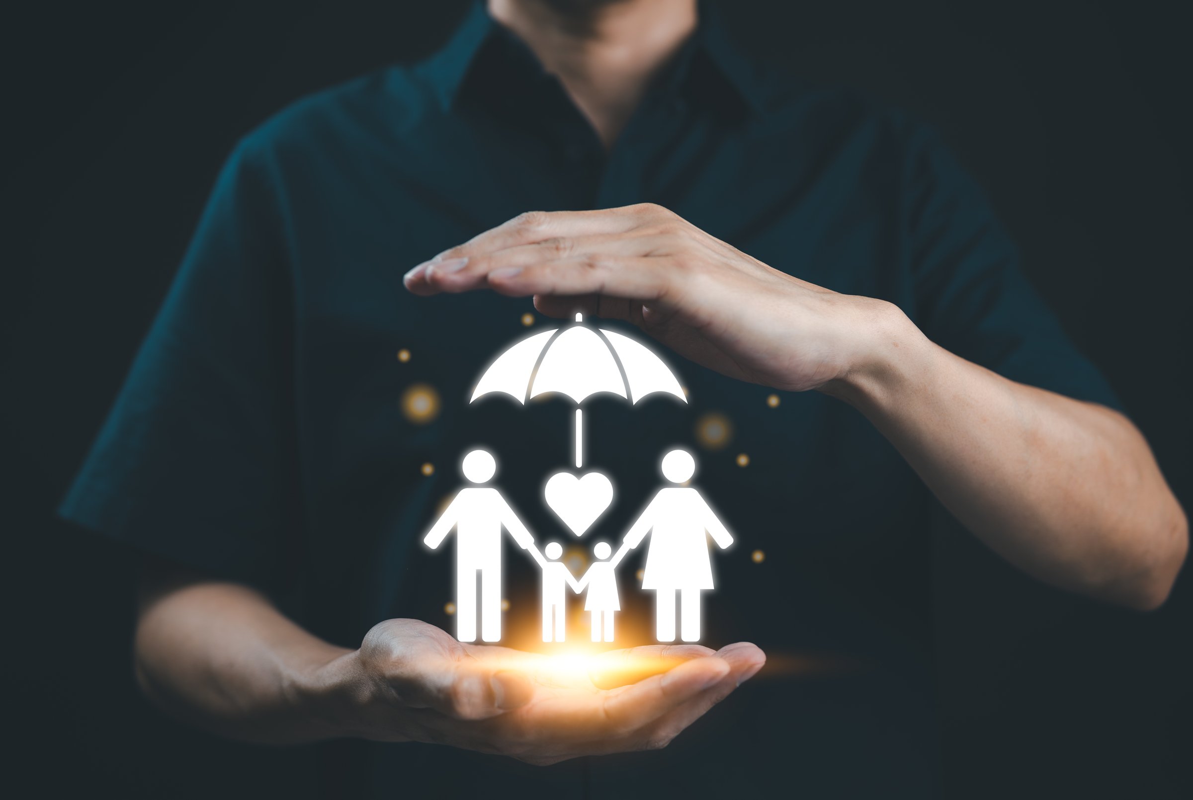 Family Protection and Safety Concept. A person covers digital icon representing family under an umbrella, symbolizing protection, safety, and security for loved ones, family care, and well-being.