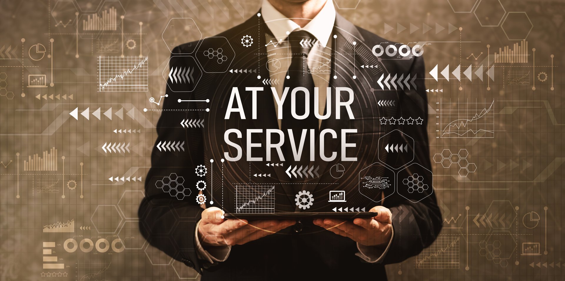 At your service with businessman holding a tablet computer on a dark vintage background