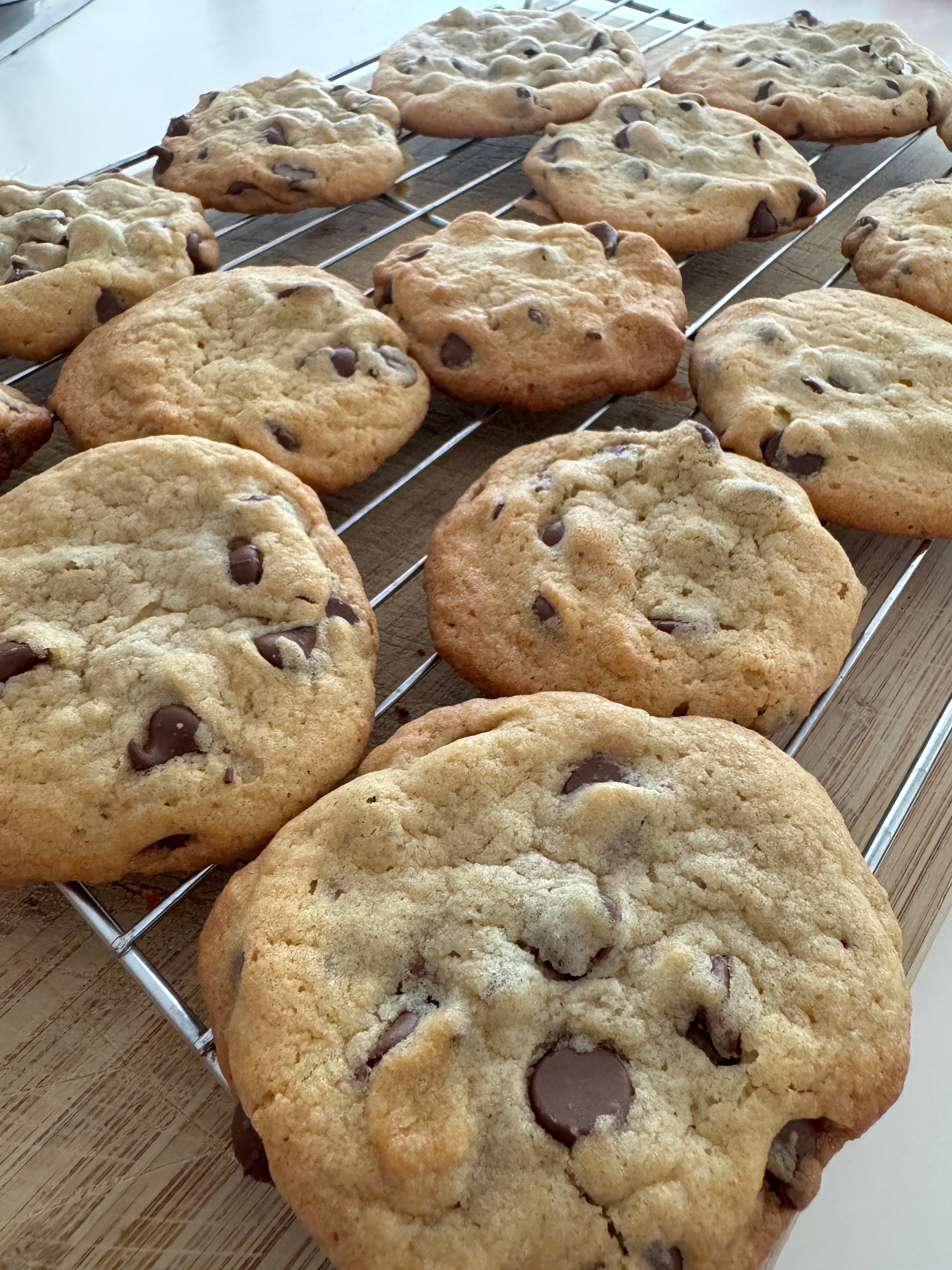 Homemade chocolate chip cookies on a cooling rack