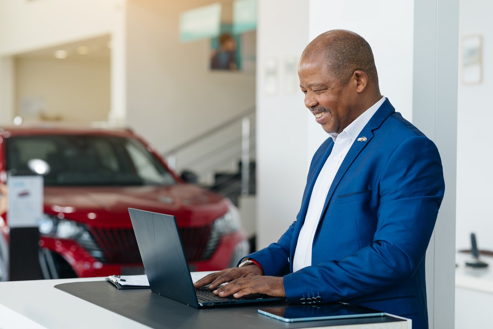A satisfied African American businessman smiling in office