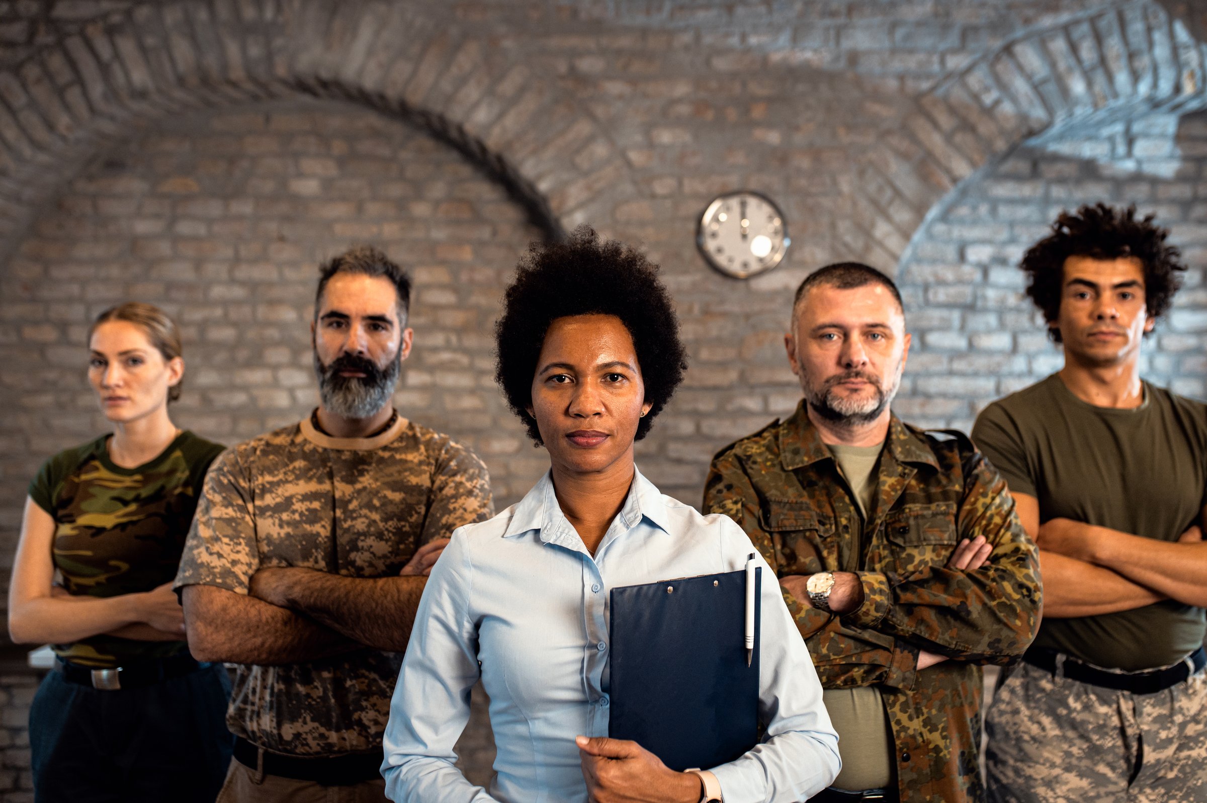 Portrait of diverse veterans at PTSD support group.