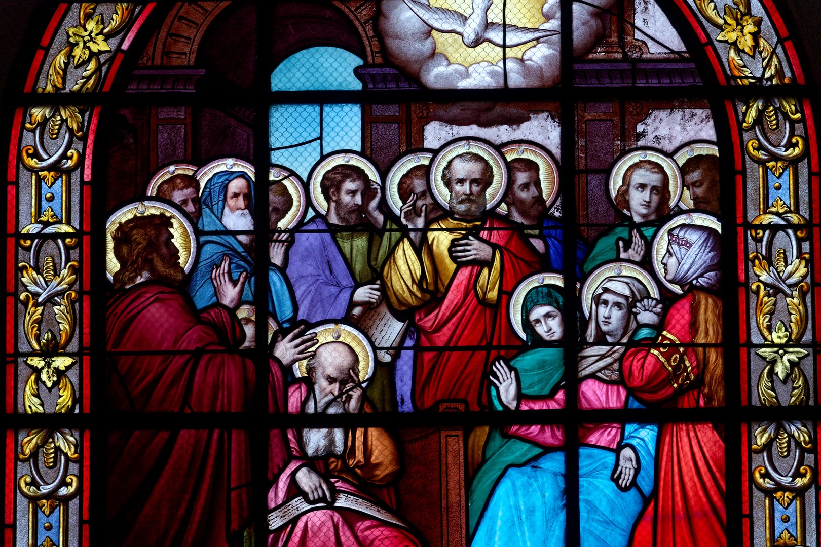 Church Notre-Dame de Béthléem, Ferrières en Gatinais, France - 01-27-2025: Stained glass (19th century) of Pentecost sunday: The Holy Spirit comes and descending on disciples as tongues of fire.