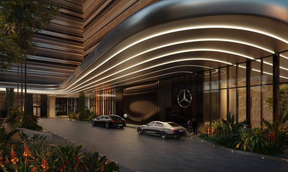 Elegant hotel entrance with luxury cars, sleek modern architecture, and illuminated curved lines at night.