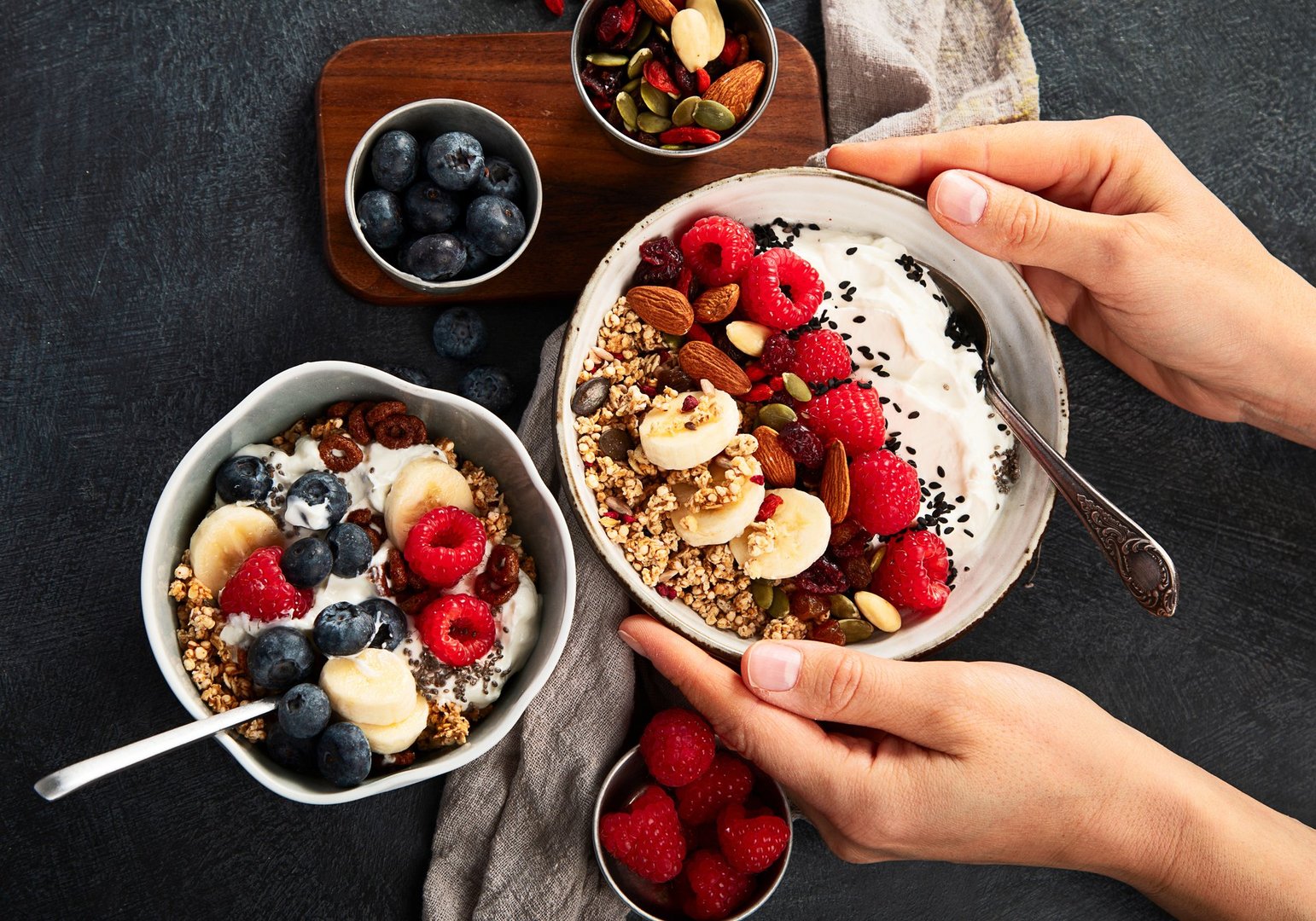Healthy breakfast cereal bowl homemade granola with fresh raspberry, blueberry and chia seeds Diet nutrition concept.