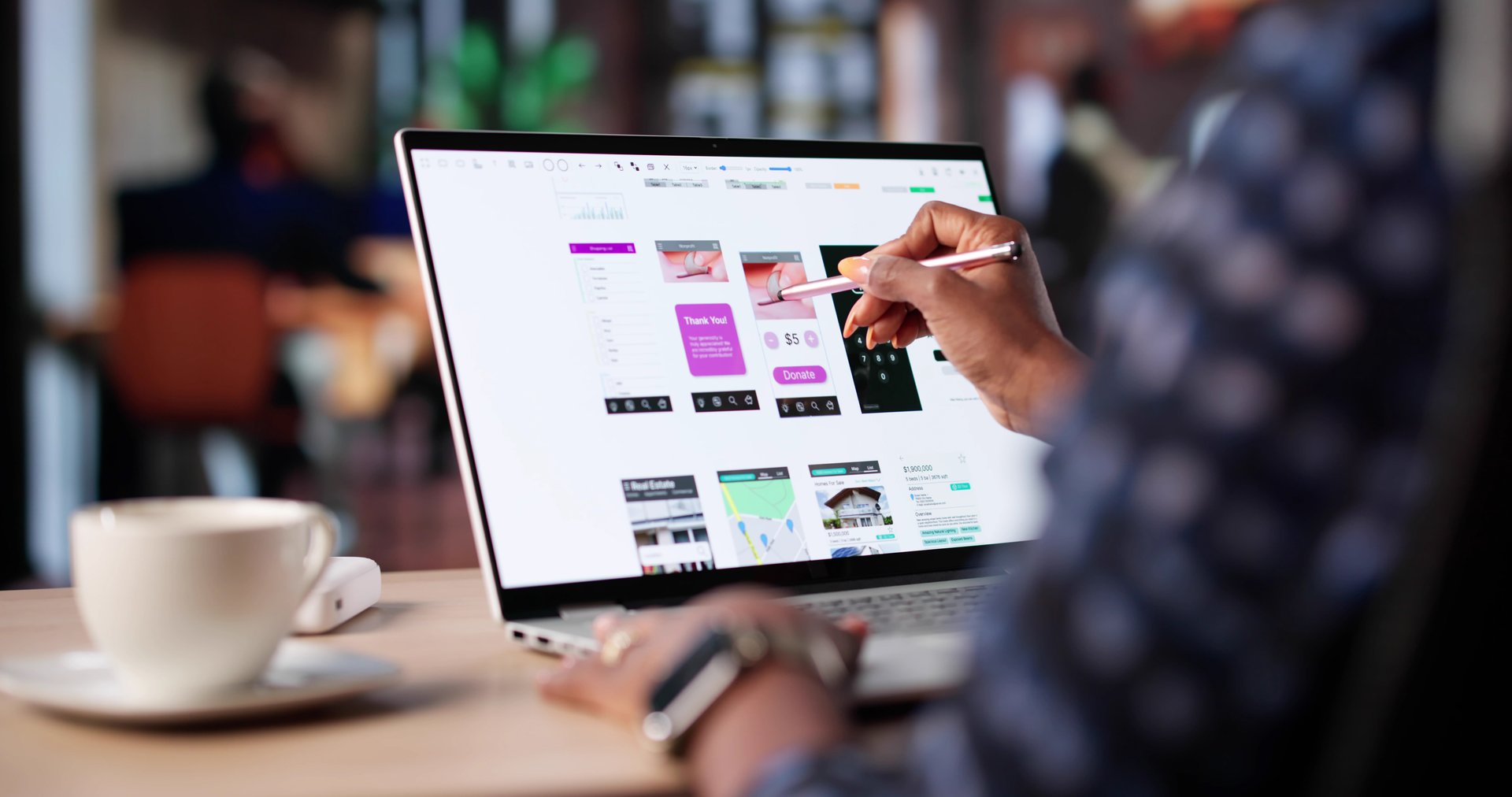 Black Businesswoman Designs User Interface On Laptop At Coffee Shop