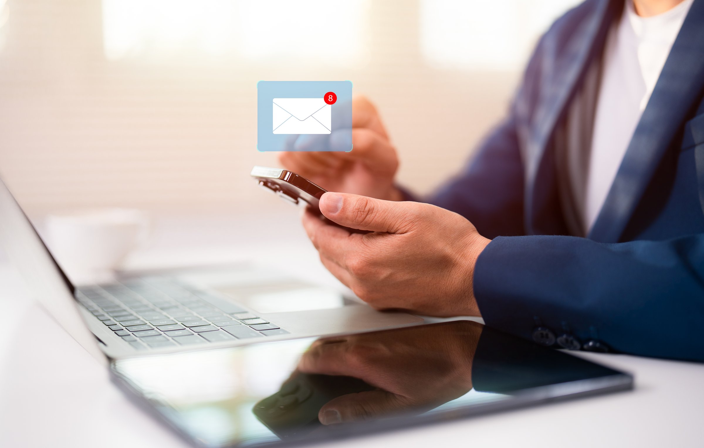 Hand of A Businessman using mobile phone open an email with sign reminder for unread emails for notification and taps on a new inbox email notification icon, newsletter. Technology digital online network.