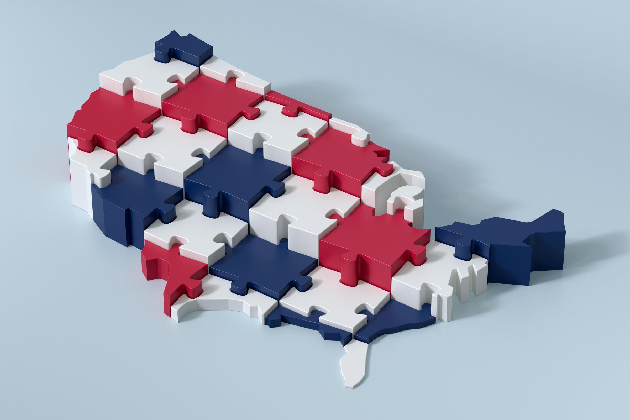 Jigsaw Puzzle Pieces Forming the USA Map with the National Colors Red, White and Blue