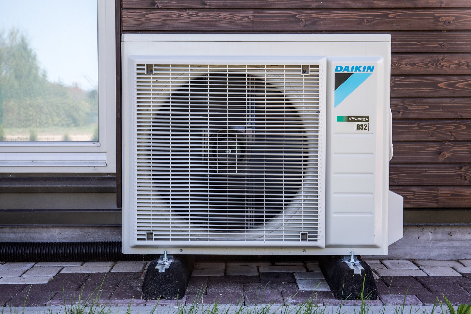 Sigulda, Latvia - August 12, 2023: Daikin Air conditioner outdoor unit installed
