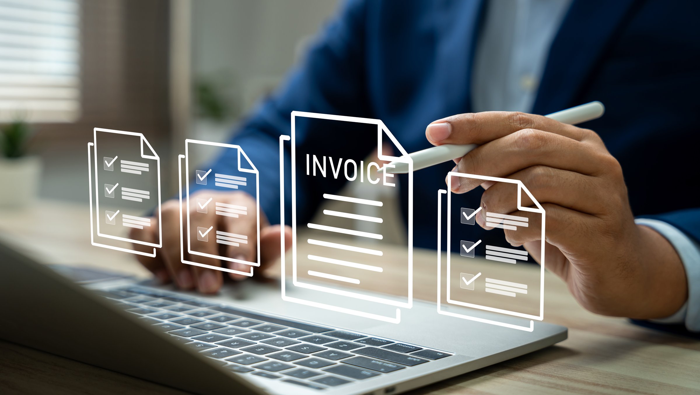 E-Invoice and Digital billing concept, Businessman using laptop to manage electronic statements on virtual screen. E-tax, Digital receipt, Online invoice processing and tax accounting solutions.