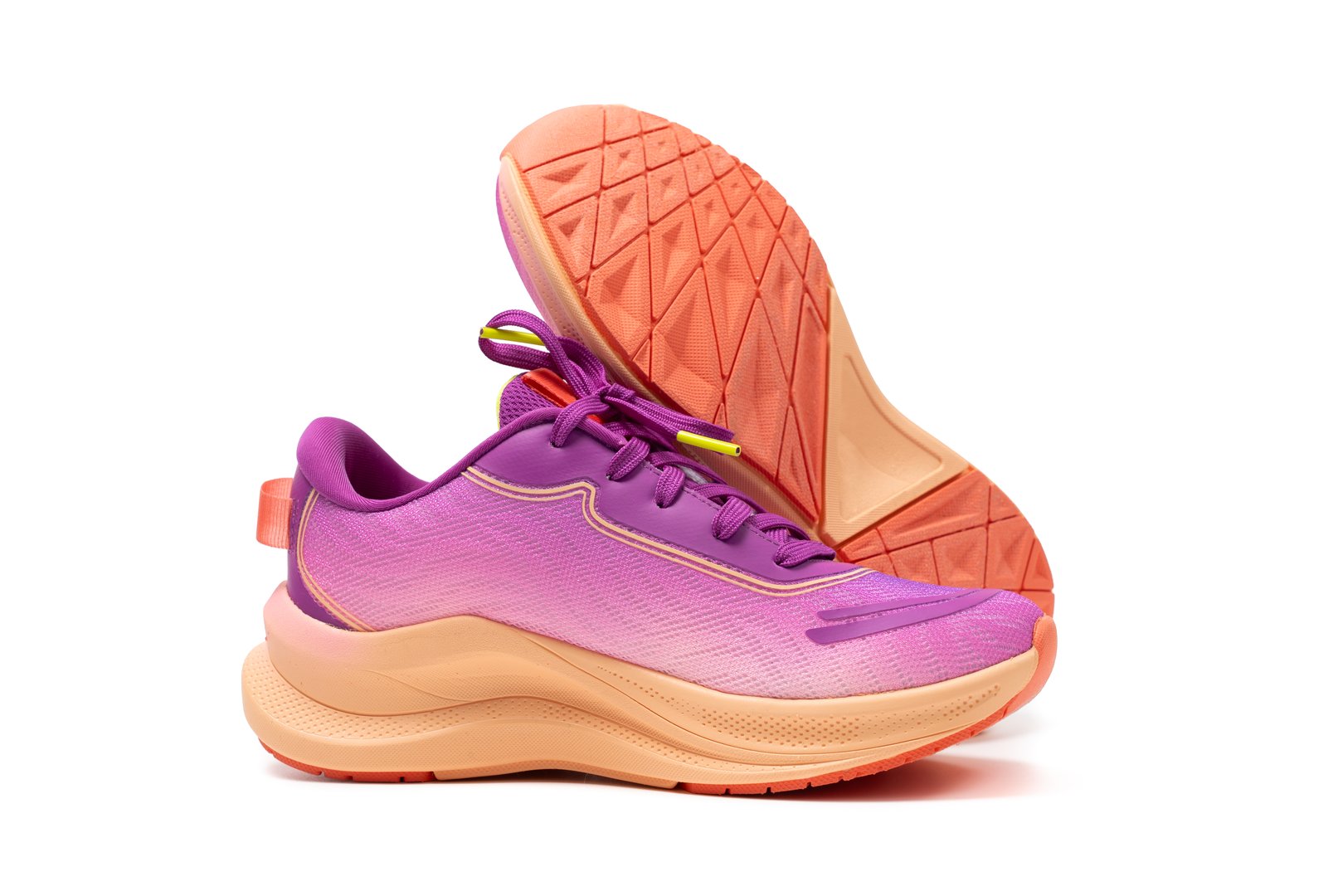 Pair of generic purple pink sport shoes isolated on white background