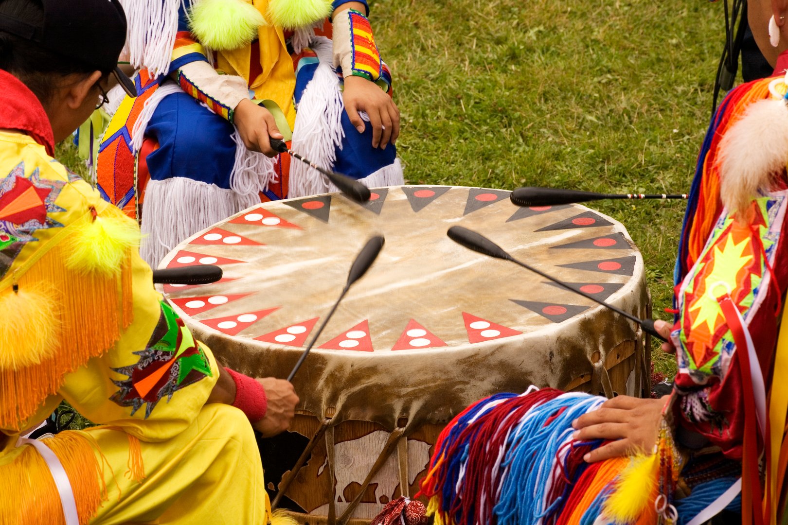 Beating Drum at Indian Pow Wow  Teamwork Colorful regalia