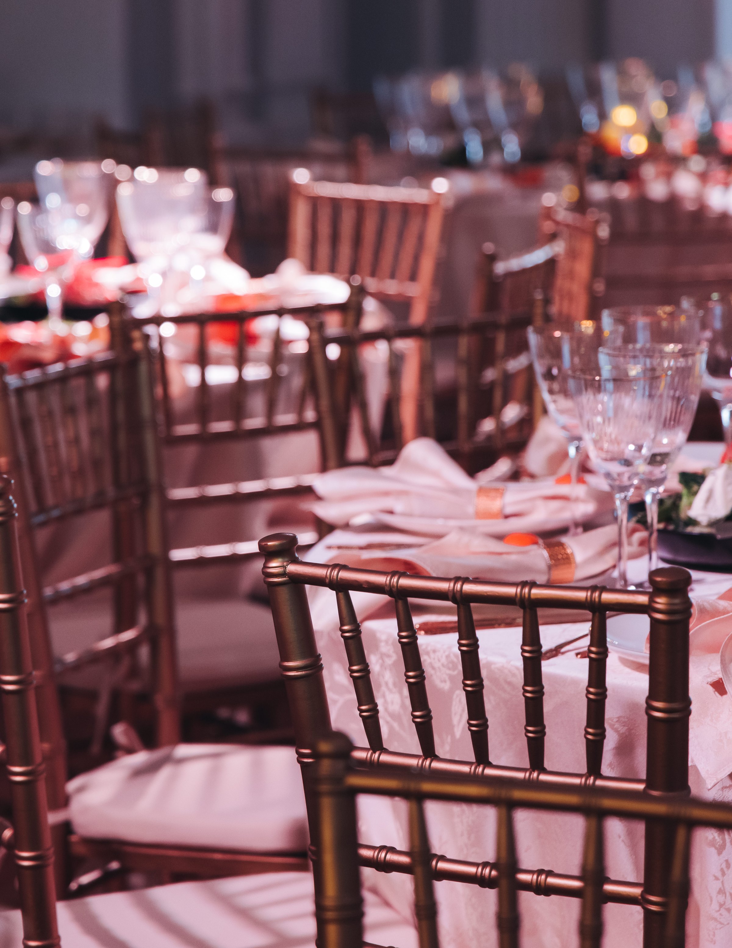 Beautiful table decoration for luxury event in pink and gold, cutlery and tableware, banquet hall arrangement decor, celebration in restaurant with flowers, candles on a wedding reception party