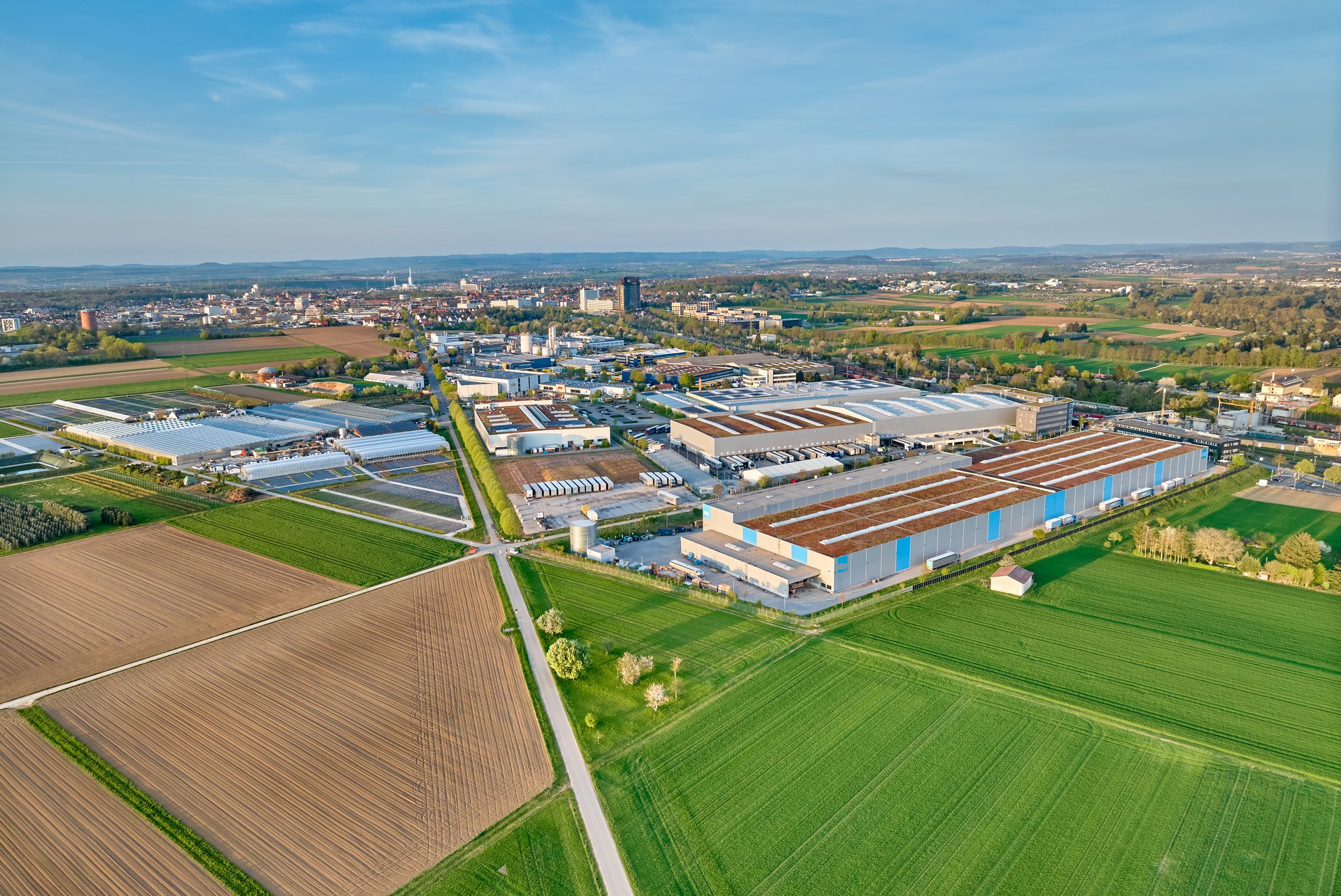 aerial photo of a industrial district between fertile farmland in Kornwestheim, Baden Wuerttemberg, Germany