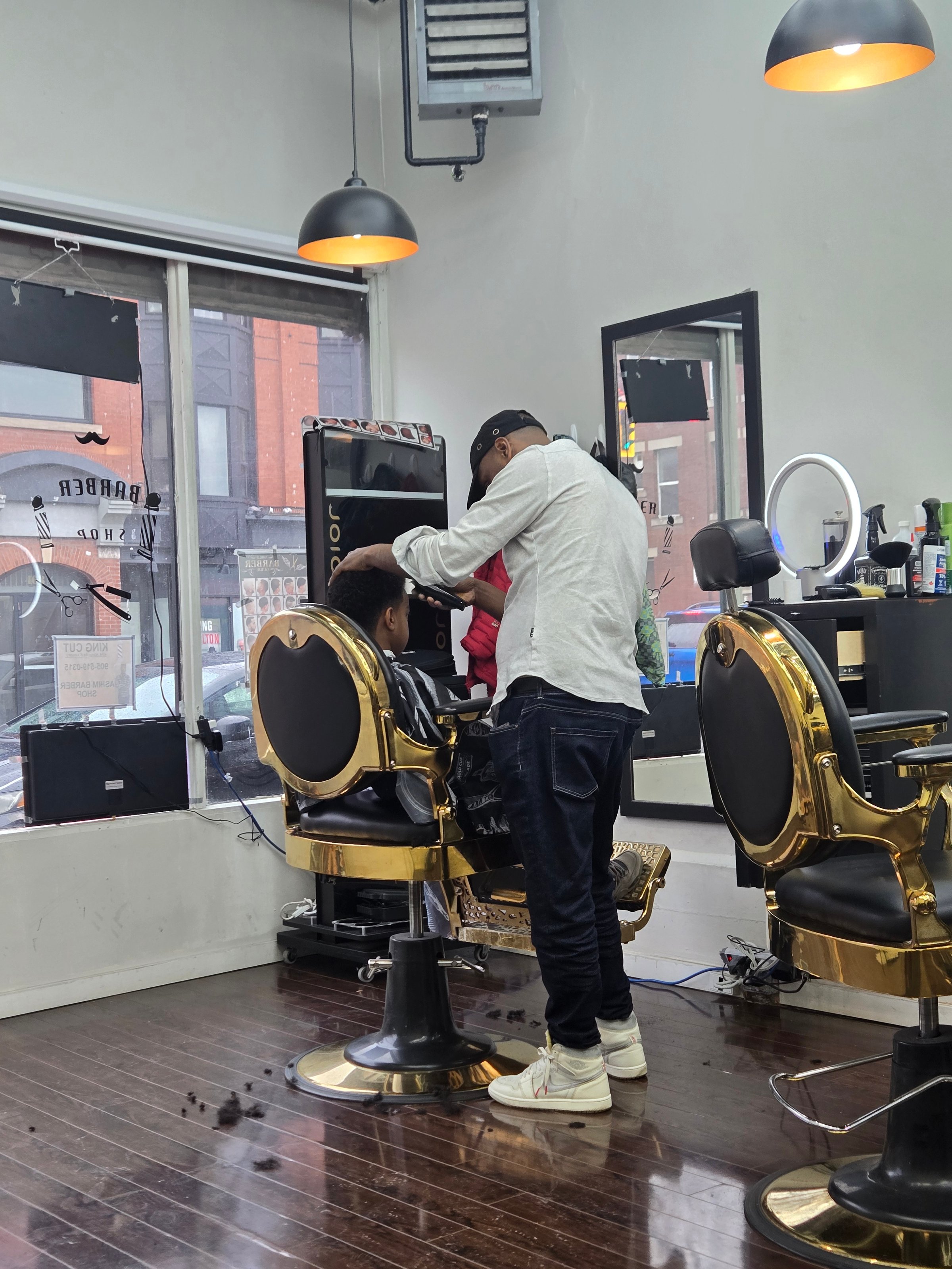 Barbershop interior with pink chairs