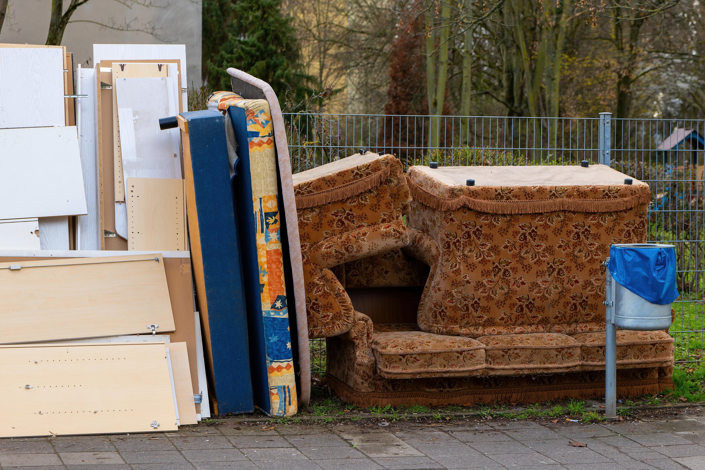 different bulky waste at the roadside in the city