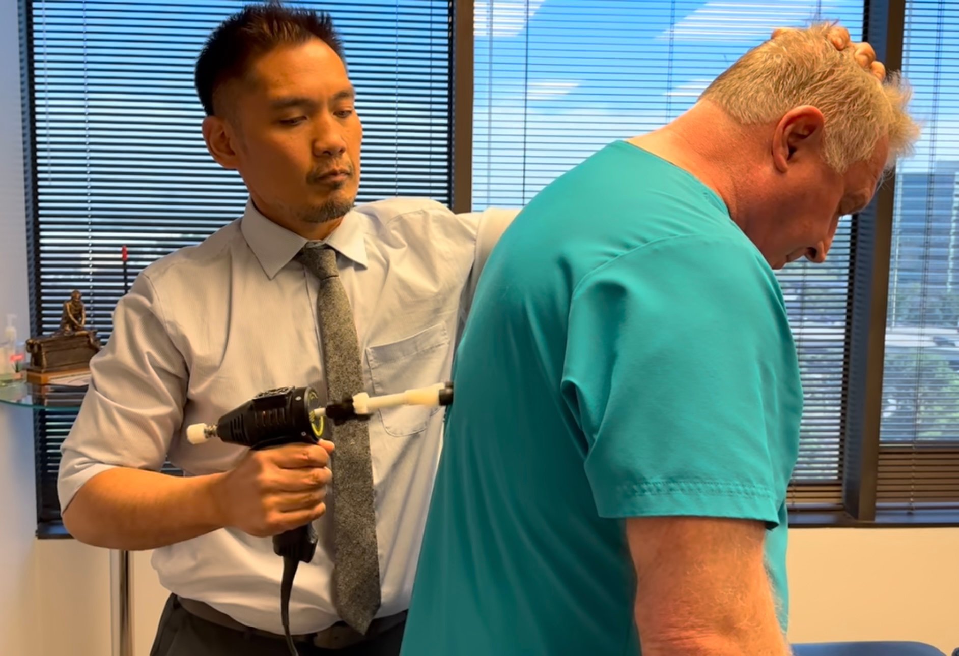 Dr. Bantique performing chiropractic treatment at Bantique Chiropractic