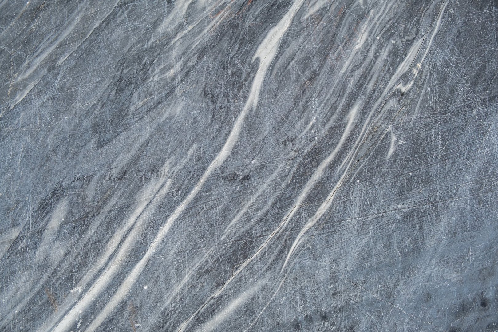 This gray marble features beautiful white veining, highlighting its natural patterns and ideal use for elegant surfaces and decor.