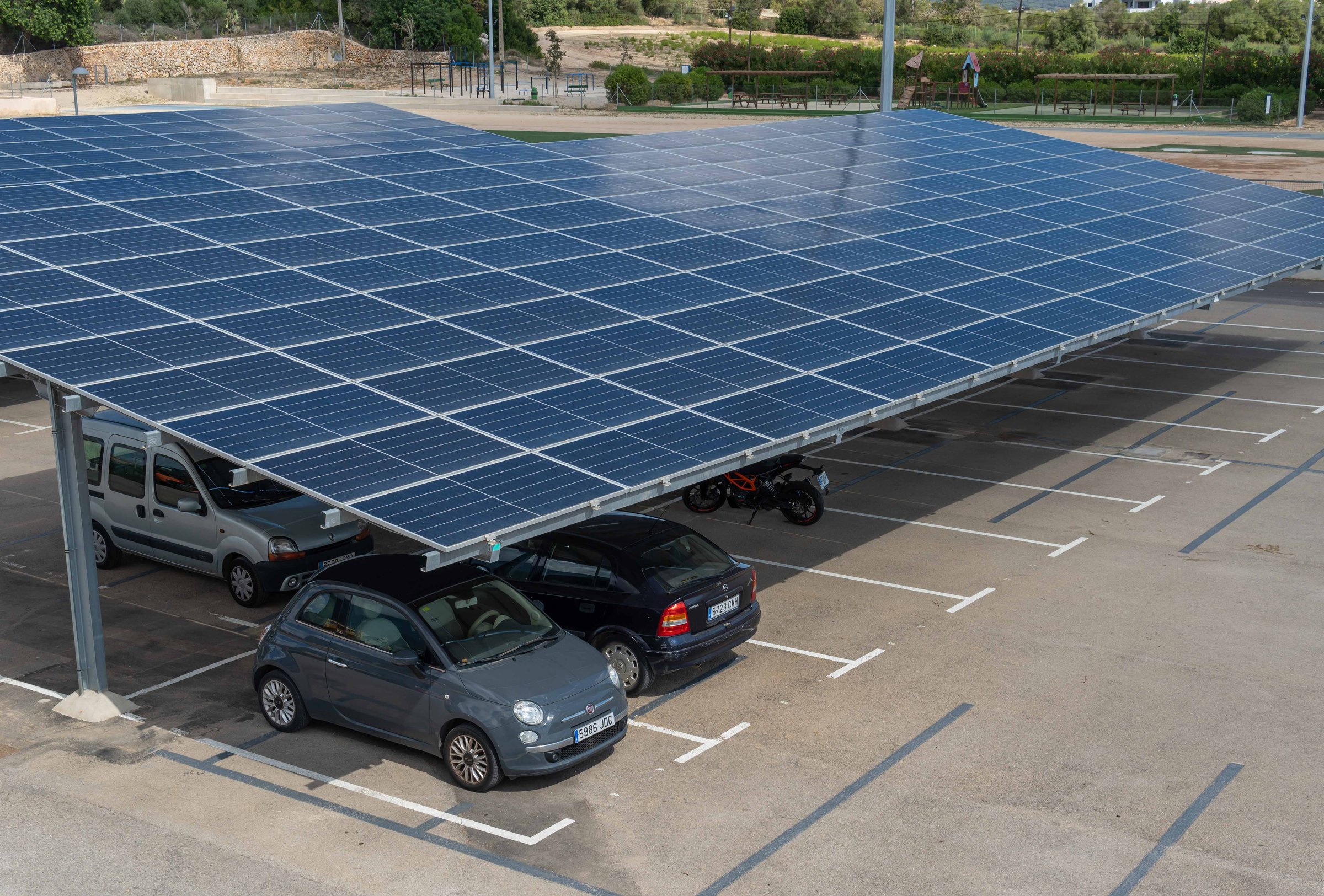Felanitx, Spain; september 23 2022: Parking lot of a sports center with solar panels for recharging electric cars. Island of Mallorca, Spain