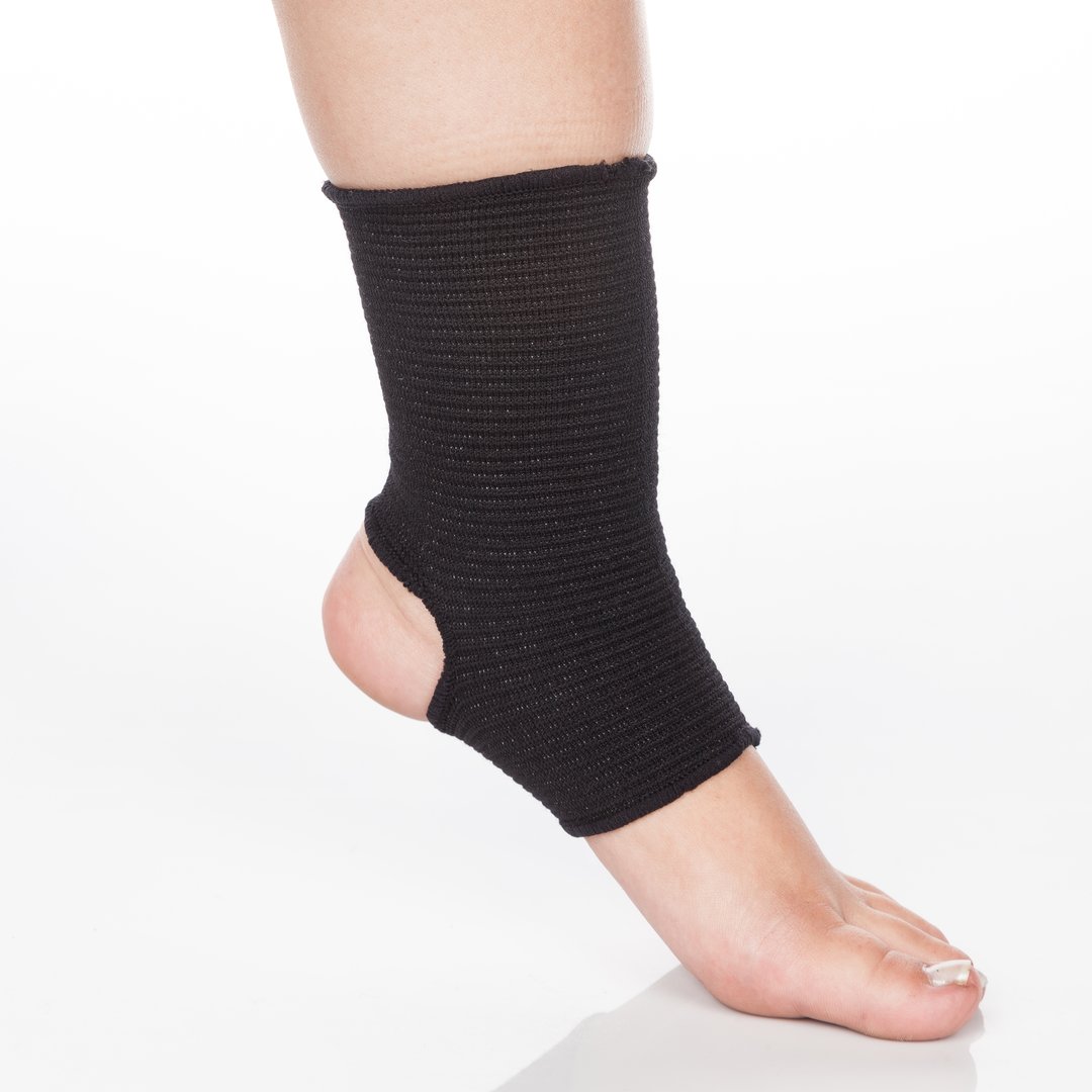 Orthopedic support for ankle on white background. Orthopedic Anatomic Orthosis. Braces for knee fixation, injuries and pain. Orthotics. Foot orthosis. Knee Joint Bandage Sleeve. Elastic Sports