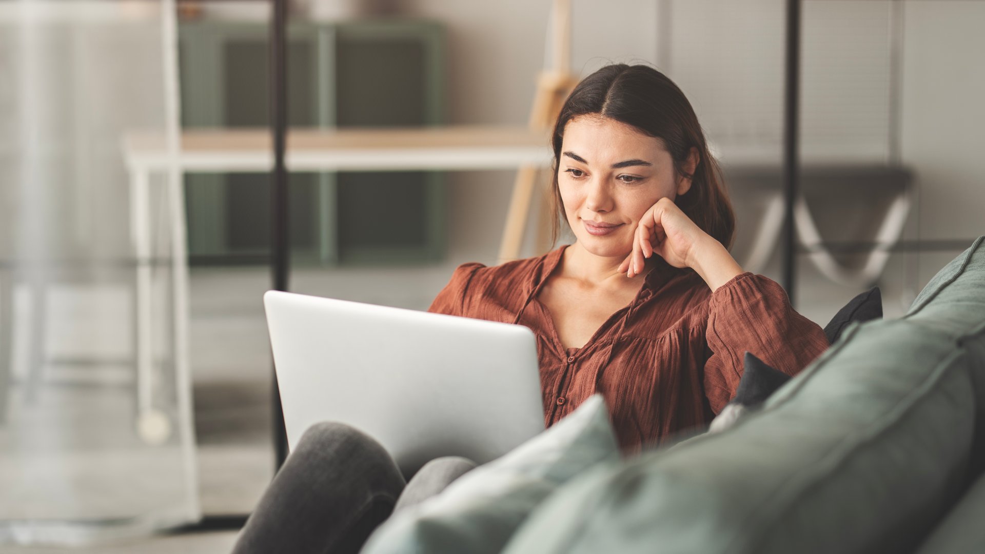 Woman using laptop at living room