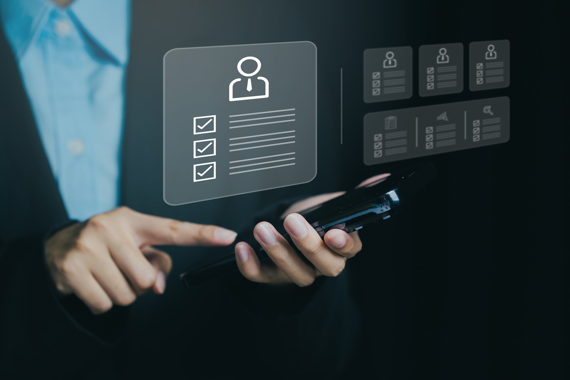 Close-up of a person using a smartphone with digital icons, symbolizing online management and personal data organization.