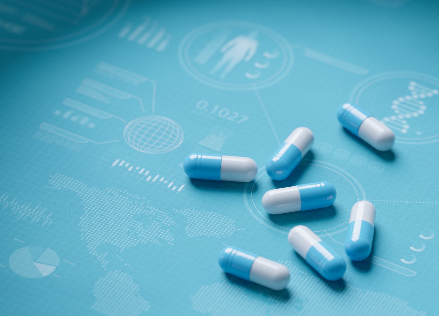 Blue and white medical capsules on flat surface showing infographics and charts relating to pharmaceutical research and development and global consumption.