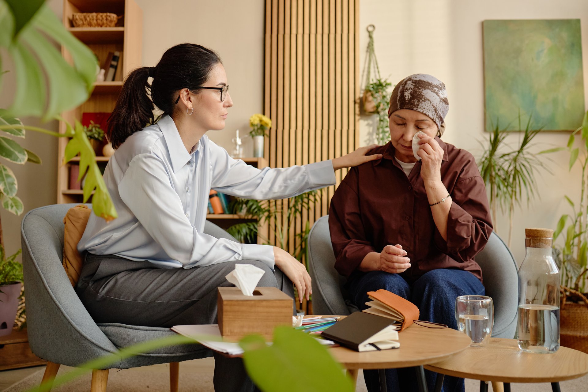 Trauma counseling session with compassionate therapist