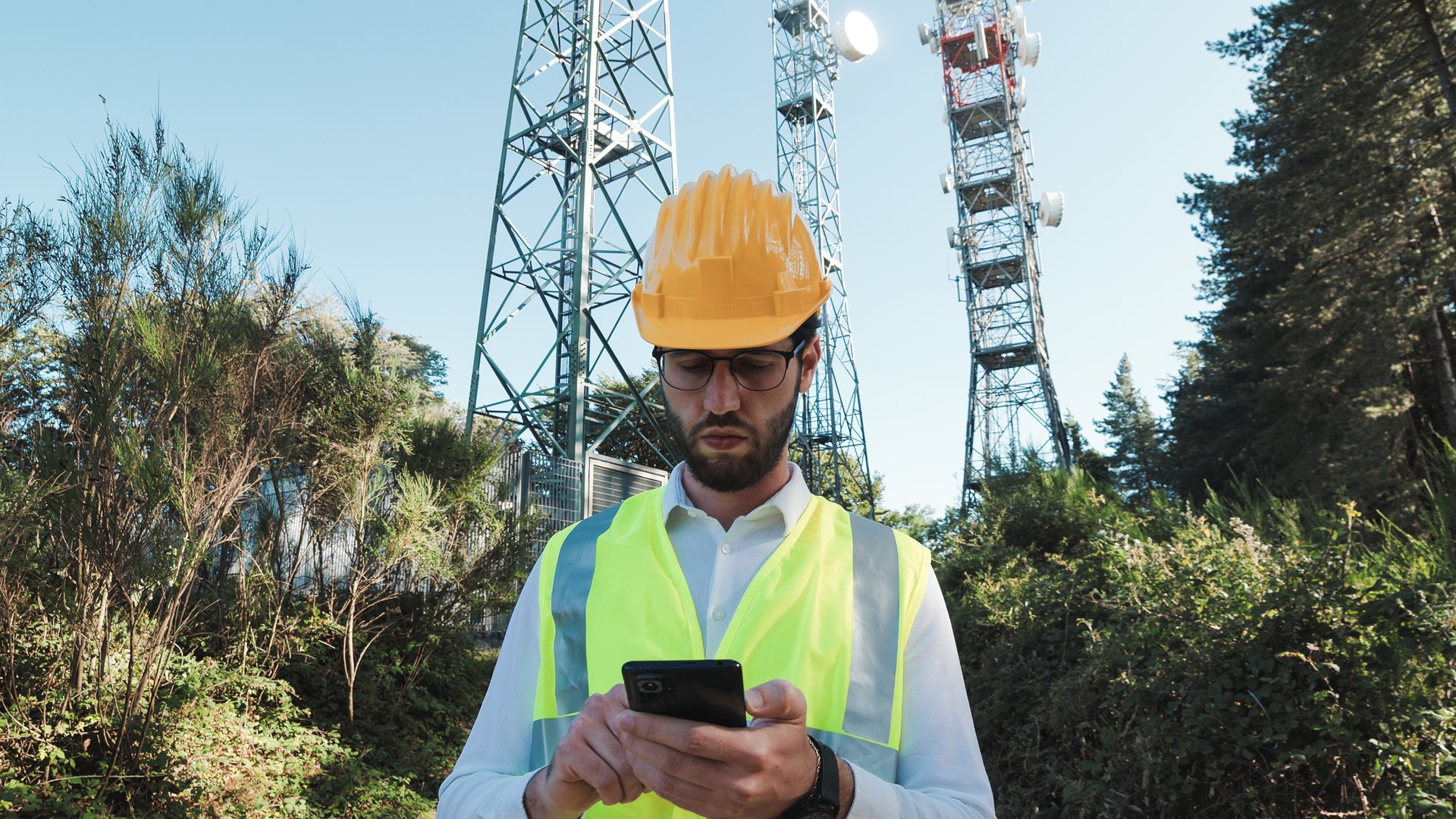 Maintenance worker pylons internet 5g checks the connection. Tracking shoot.