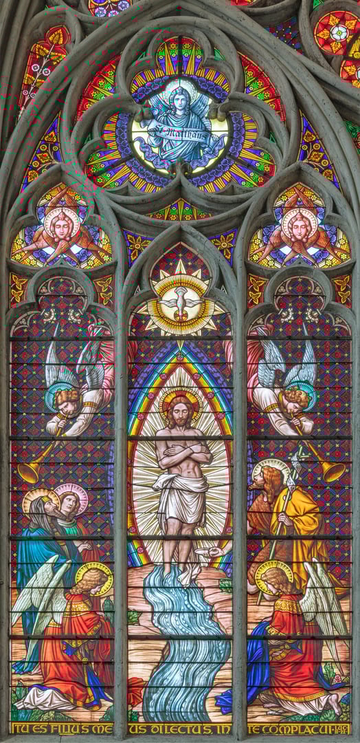 Vienna - The  Baptism of Jesus on the stained glass in the Votivkirche church originaly by workrooms from Austria.