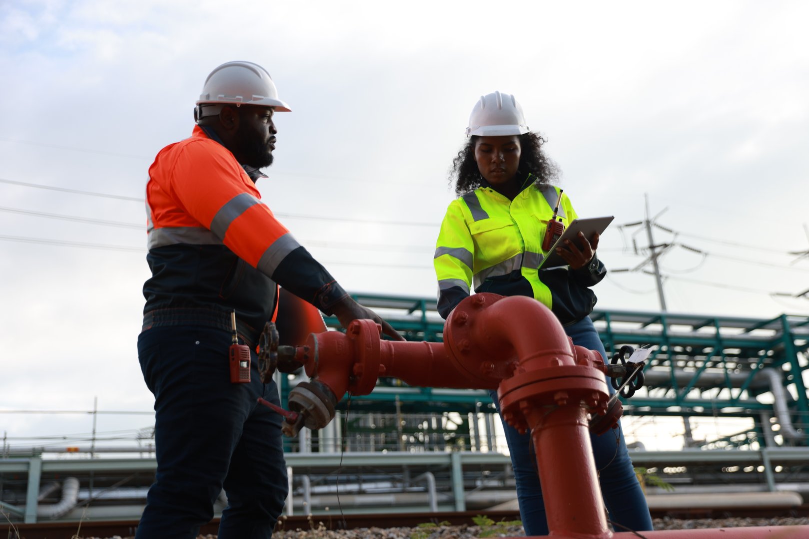 The system safety engineers team inspecting fire safety equipment Extinguishing Piping System at a chemical factory