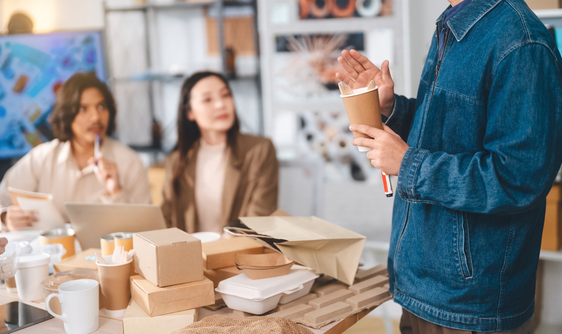 Corporate group of business Asian working together in an ESG office, planning and presentation innovations package recycle material for sustainable product.