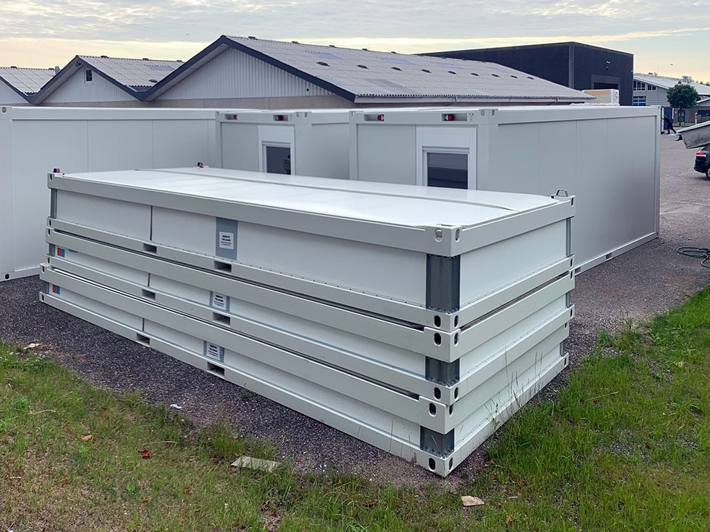 Flat pack container module assembly