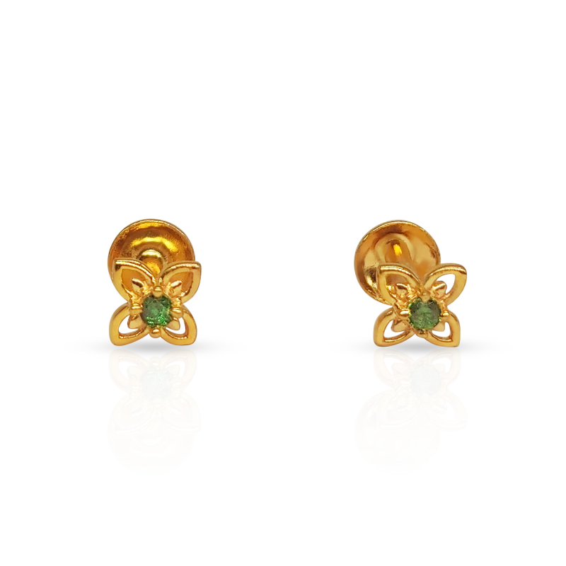 Gold butterfly earrings with green gemstone centers on a white background.