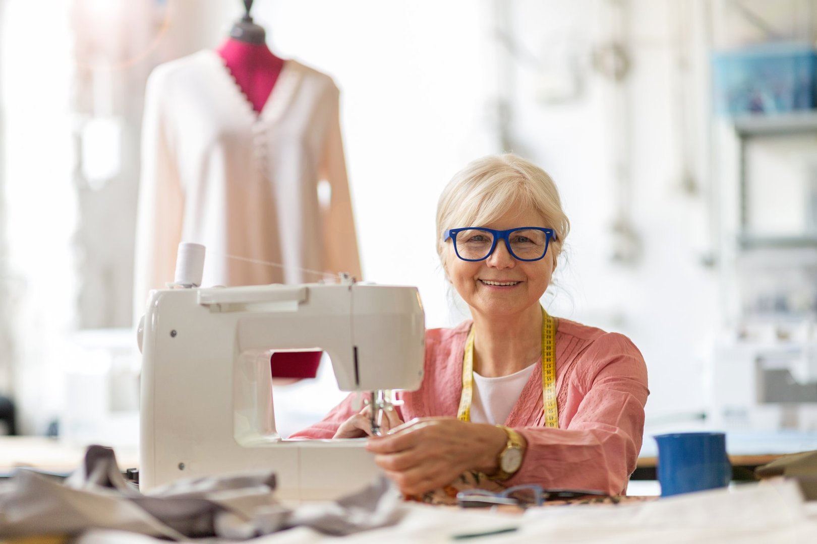 Confident senior woman working in workshop