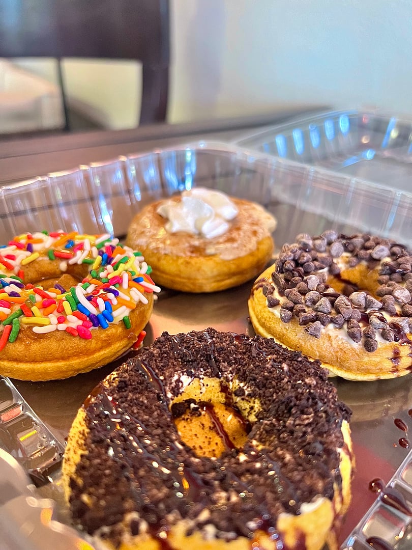 Protein donuts with various colorful toppings