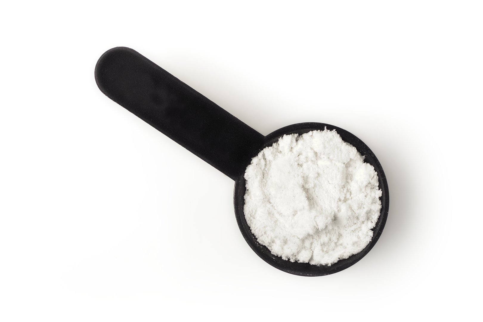 Scoop with creatine protein for sporty lifestyle. High angle view isolated on white.