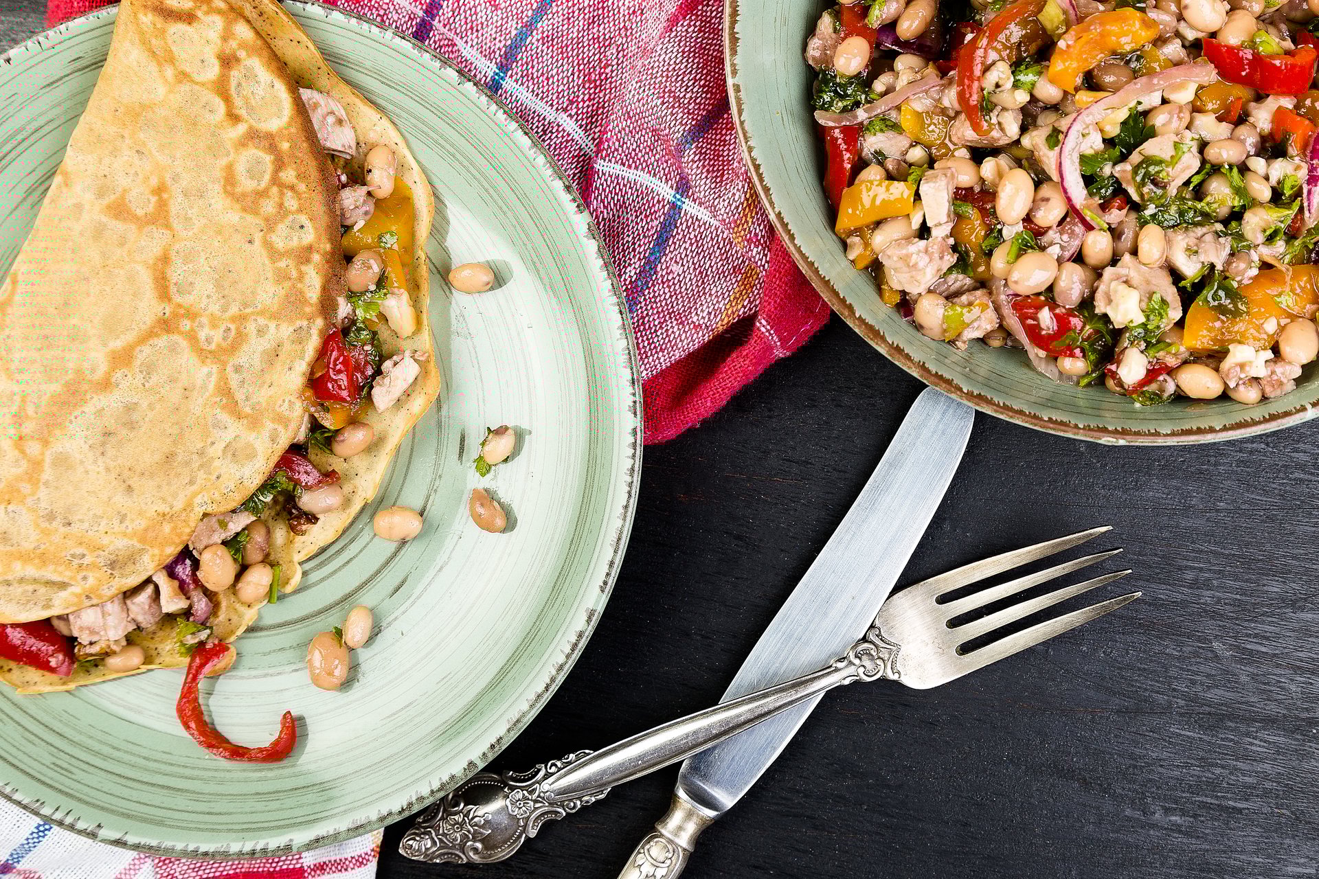 Savoury Buckwheat Pancake with White Beans, Red and Yellow Bell Pepper, Parsley and Chicken. Mexican Quesadilla. Top view.
