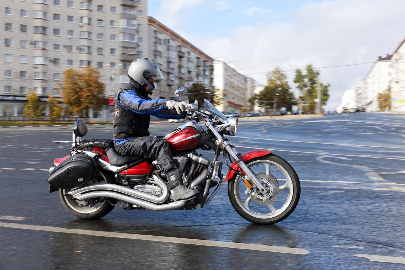 Ulyanovsk, Russia - September 27, 2025. Motorcyclist rides on a motorcycle along the autumn city street