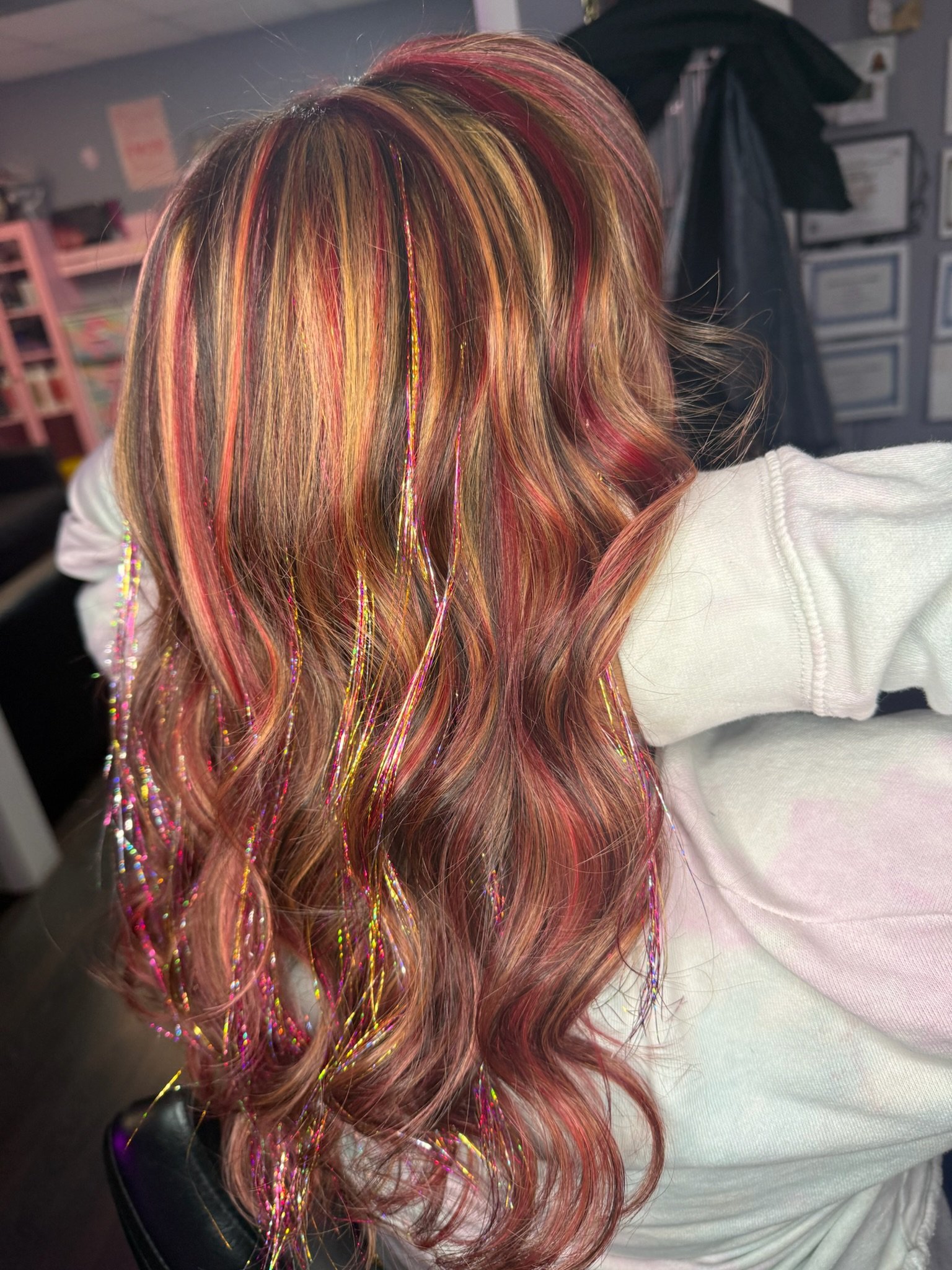 Professional copper balayage hair color with red ribbon showcasing expert balayage technique at hair salon near me in Bradenton